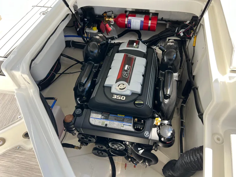 Slide: The Image of Engine compartment of a 2025 Sea Ray SDX 270 boat with a 350 HP engine. - 15