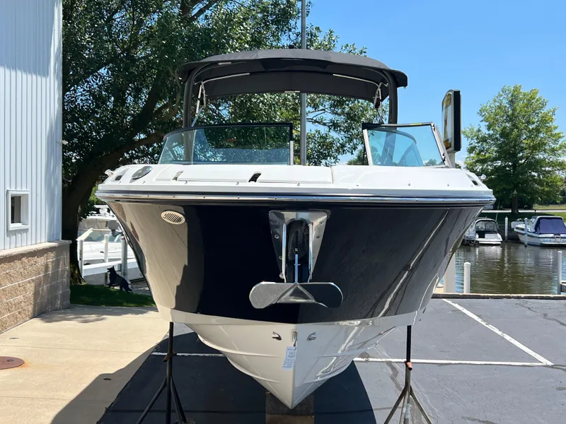 Slide: The Image of 2025 Sea Ray SDX 270 boat docked at marina, front view. - 2