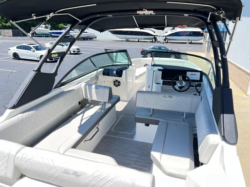 Slide: The Image of 2025 Sea Ray SDX 270 boat interior with seating and steering console. - 4