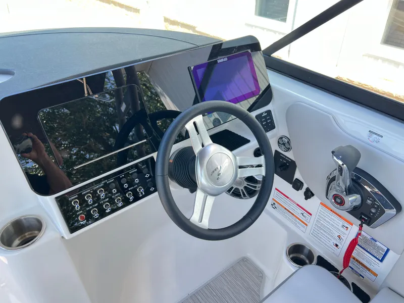 Slide: The Image of 2025 Sea Ray SDX 270 helm with modern controls and touchscreen display. - 6