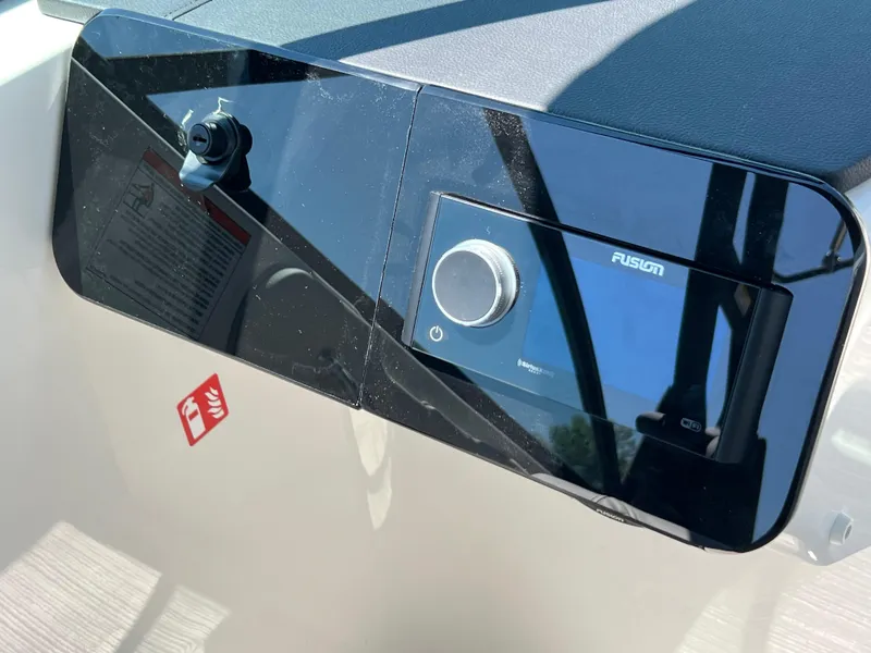 Slide: The Image of 2025 Sea Ray SDX 270 dashboard with Fusion stereo system. - 7