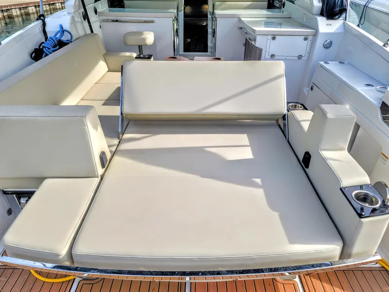 Slide: The Image of 2017 Monterey 360 Sport Coupe boat interior with spacious seating and modern amenities. - 11