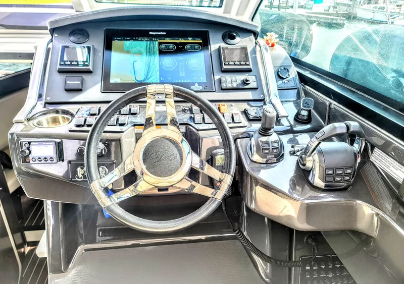 Slide: The Image of Cockpit of 2017 Monterey 360 Sport Coupe with advanced navigation controls and steering wheel. - 21