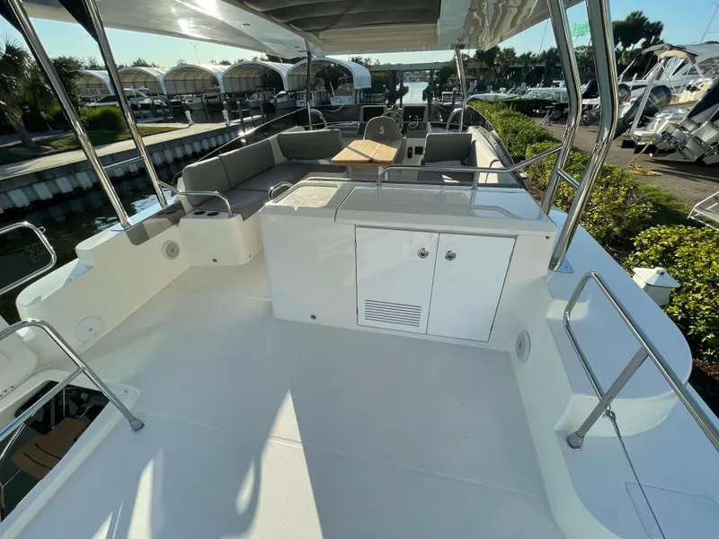 Slide: The Image of 2025 Beneteau Swift Trawler 48 flybridge with seating and storage. - 22