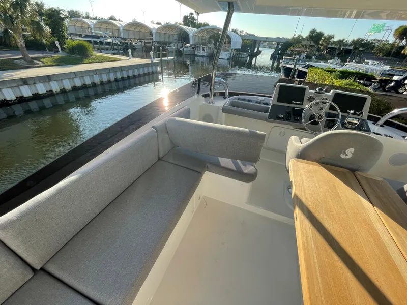 Slide: The Image of 2025 Beneteau Swift Trawler 48 interior with seating and helm station. - 29