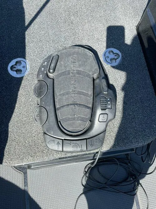 Slide: The Image of Nitro ZV21 2022 boat foot pedal control on carpeted deck. - 14