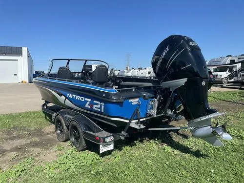 Slide: The Image of 2022 Nitro ZV21 boat with Mercury 400 outboard motor in a parking lot. - 4