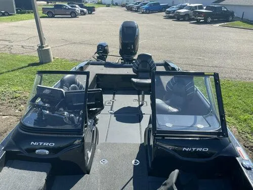 Slide: The Image of 2022 Nitro ZV21 fishing boat with dual consoles and outboard motor. - 6