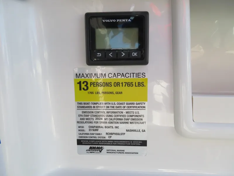 Slide: The Image of 2024 Chaparral 23 Surf boat capacity label, max 13 persons or 1765 lbs. - 13