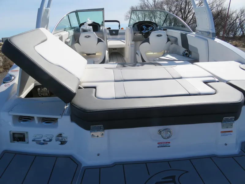 Slide: The Image of 2024 Chaparral 23 Surf boat interior with seating and dashboard. - 8