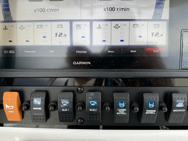 Slide: The Image of Control panel of a 2019 Sea Hunt Gamefish 27 Forward Seating boat. - 13