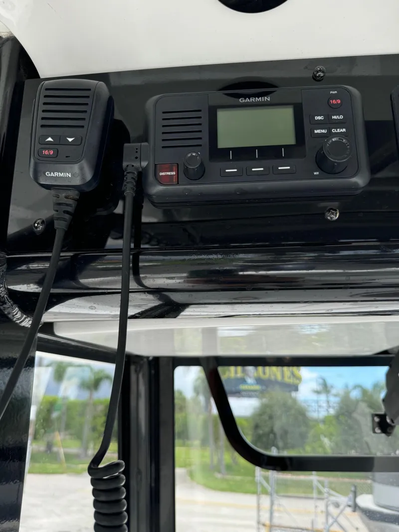 Slide: The Image of Garmin radio system on 2019 Sea Hunt Gamefish 27 Forward Seating boat. - 17