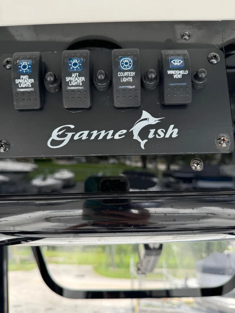 Slide: The Image of 2019 Sea Hunt Gamefish 27 Forward Seating control panel with light switches. - 18