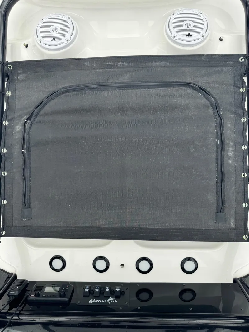 Slide: The Image of 2019 Sea Hunt Gamefish 27 Forward Seating boat dashboard with speakers and controls. - 19