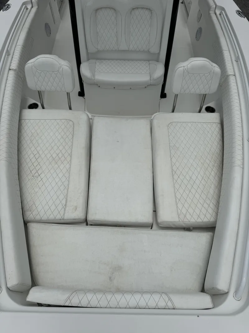 Slide: The Image of 2019 Sea Hunt Gamefish 27 Forward Seating, white cushioned seats. - 22