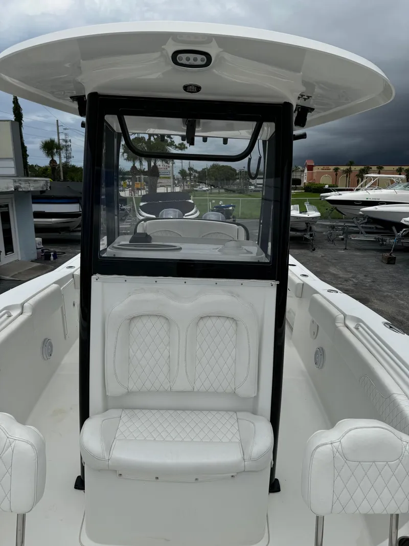 Slide: The Image of 2019 Sea Hunt Gamefish 27 Forward Seating boat with white interior. - 23