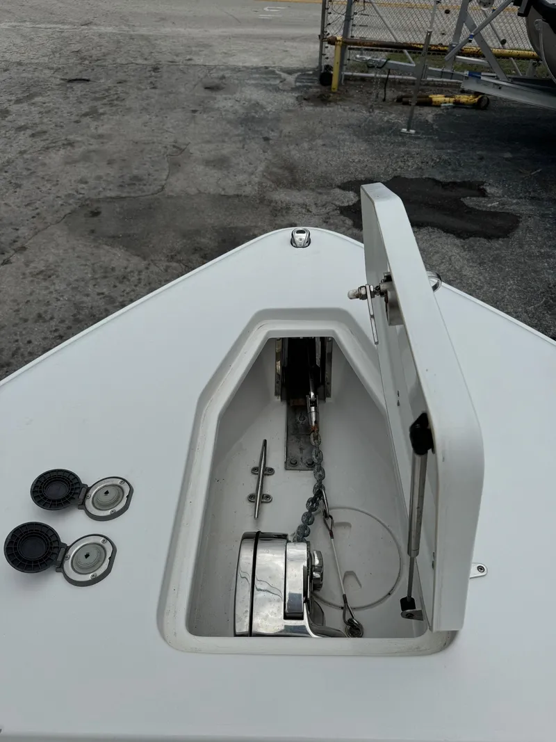 Slide: The Image of 2019 Sea Hunt Gamefish 27 Forward Seating anchor locker and windlass system. - 28