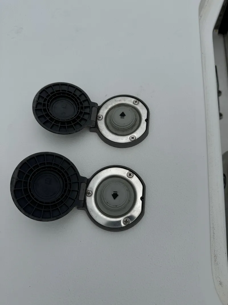 Slide: The Image of Fuel and water fill ports on a 2019 Sea Hunt Gamefish 27 Forward Seating boat. - 29