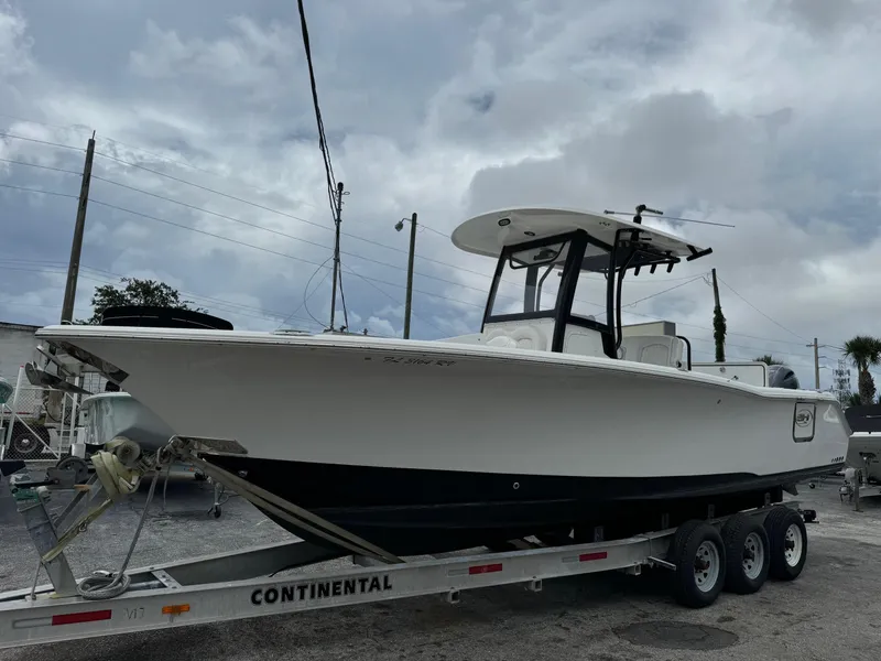 Slide: The Image of 2019 Sea Hunt Gamefish 27 Forward Seating boat on a Continental trailer. - 3