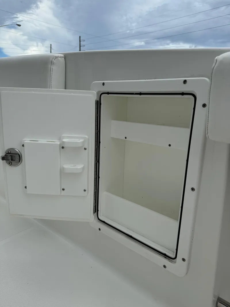Slide: The Image of Open storage compartment on a 2019 Sea Hunt Gamefish 27 Forward Seating boat. - 31