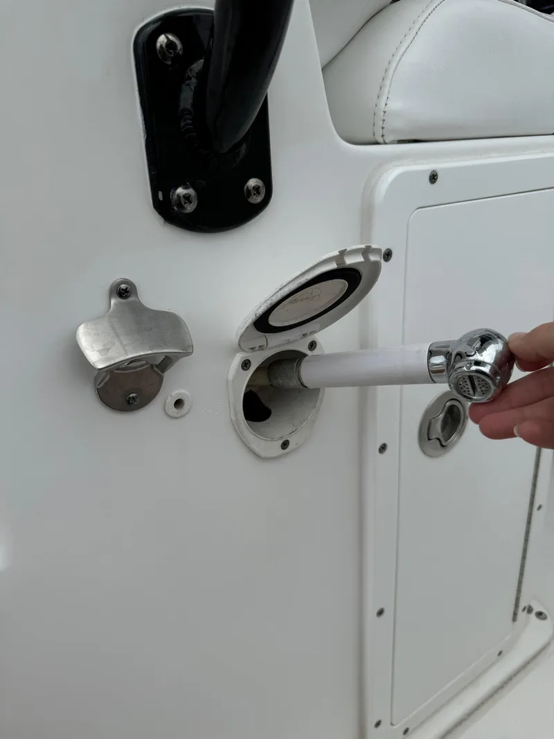 Slide: The Image of 2019 Sea Hunt Gamefish 27 Forward Seating fuel port being accessed. - 33