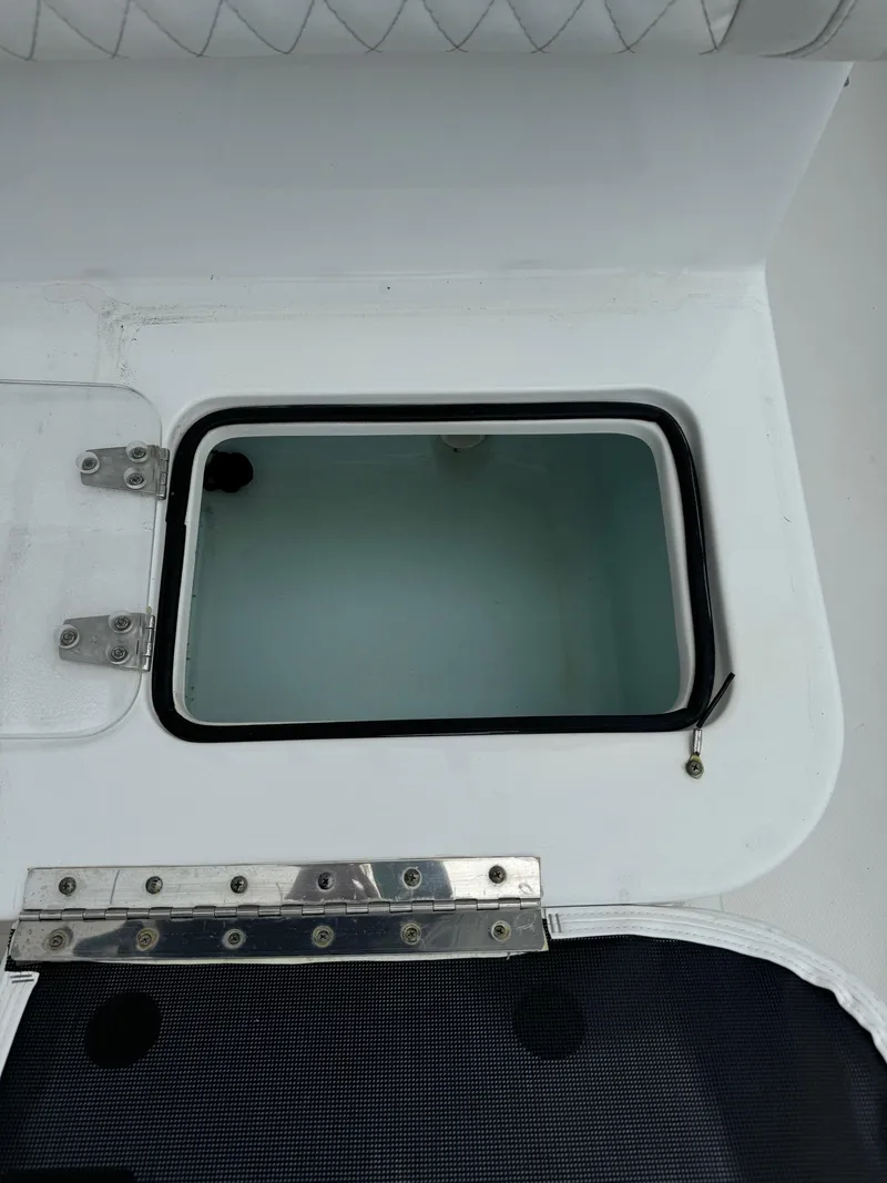 Slide: The Image of 2019 Sea Hunt Gamefish 27 Forward Seating livewell compartment. - 36