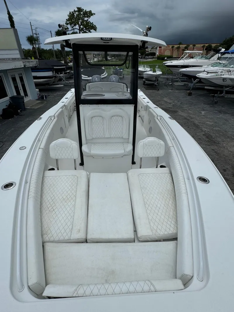 Slide: The Image of 2019 Sea Hunt Gamefish 27 Forward Seating boat with white interior. - 7