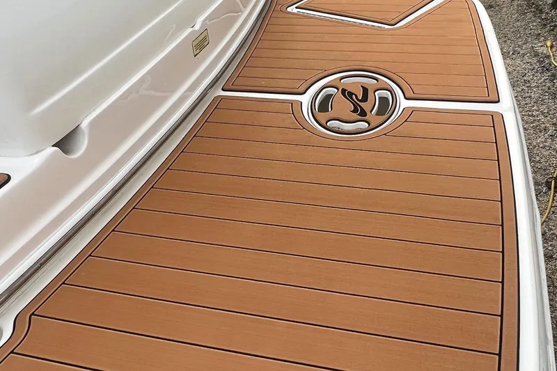 Slide: The Image of Teak deck of a 2002 Sea Ray 300 Sundancer boat. - 10