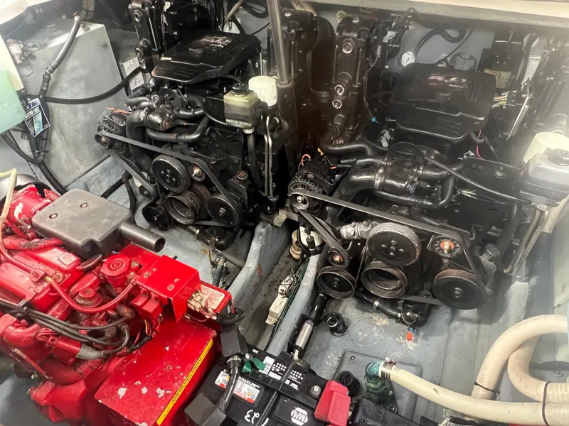 Slide: The Image of Engine compartment of a 2002 Sea Ray 300 Sundancer boat showing twin engines. - 27