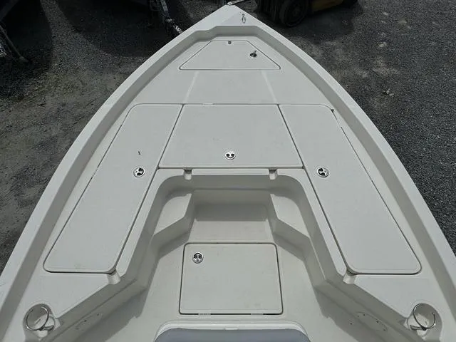 Slide: The Image of 2021 Skeeter SX210 boat bow with storage compartments. - 11