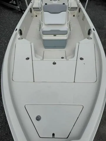 Slide: The Image of 2021 Skeeter SX210 boat interior with seating and storage compartments. - 17