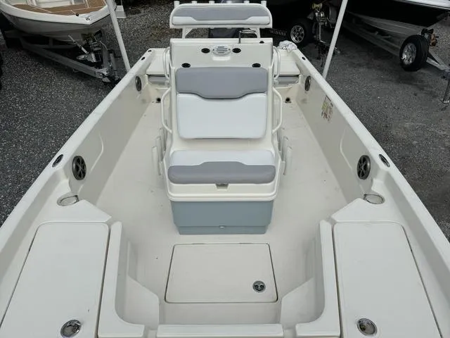 Slide: The Image of 2021 Skeeter SX210 boat interior with seating and storage compartments. - 18