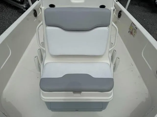 Slide: The Image of 2021 Skeeter SX210 boat seat with white and gray cushions. - 19