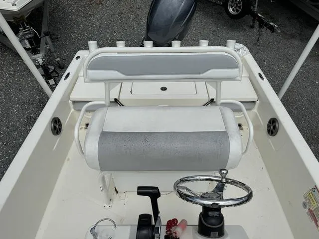 Slide: The Image of 2021 Skeeter SX210 boat interior with steering wheel and seating. - 20