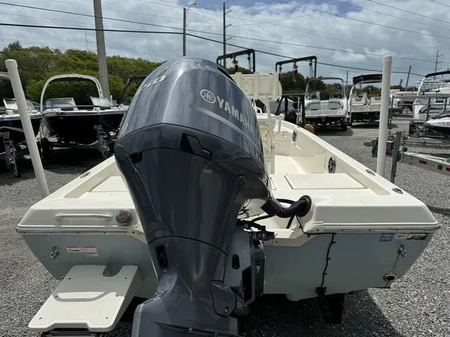 Slide: The Image of 2021 Skeeter SX210 boat with Yamaha outboard motor in a dealership lot. - 5