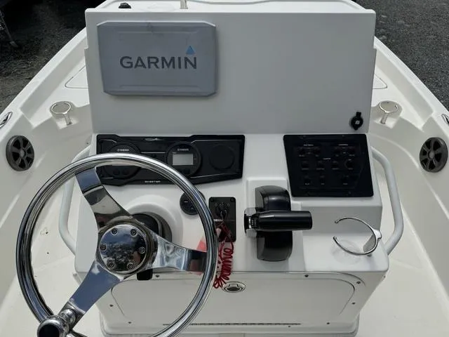 Slide: The Image of 2021 Skeeter SX210 boat console with Garmin navigation system and steering wheel. - 9