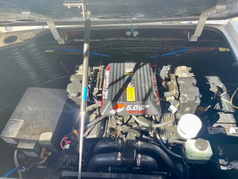 Slide: The Image of 2001 Stingray 240 CS engine compartment with 5.0L V8 motor. - 6