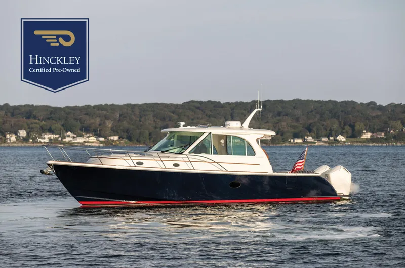 The Image of 2022 Hinckley Sport Boat 40 X on water, certified pre-owned, scenic background. - 0