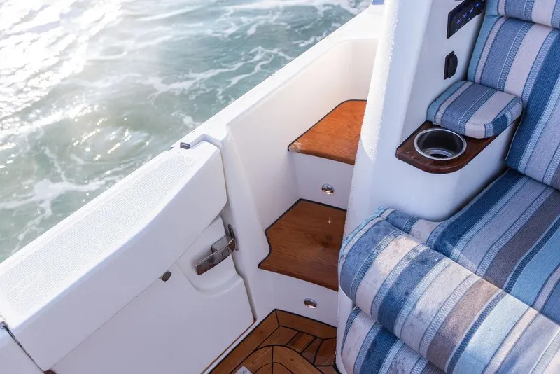 Slide: The Image of Helm of 2022 Hinckley Sport Boat 40 X with modern controls and navigation displays. - 11