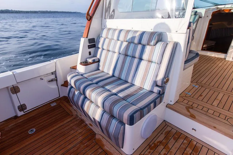 Slide: The Image of 2022 Hinckley Sport Boat 40 X dashboard with navigation and control panels. - 12