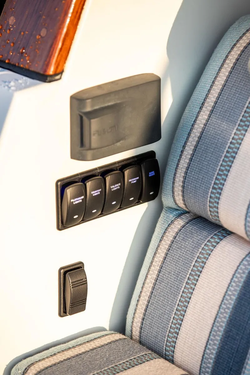 Slide: The Image of Hinckley Sport Boat 40 X 2022 dashboard with steering wheel and controls. - 13