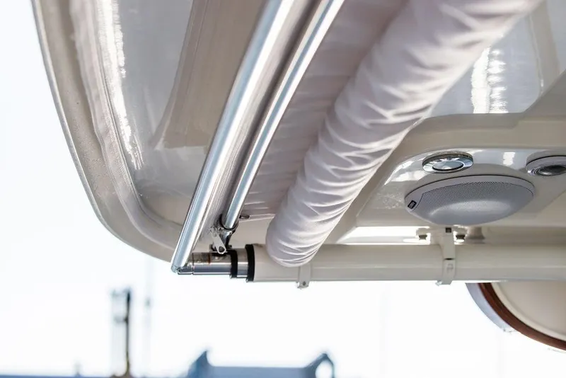 Slide: The Image of Hinckley Sport Boat 40 X 2022 dashboard with keys and control panel. - 14