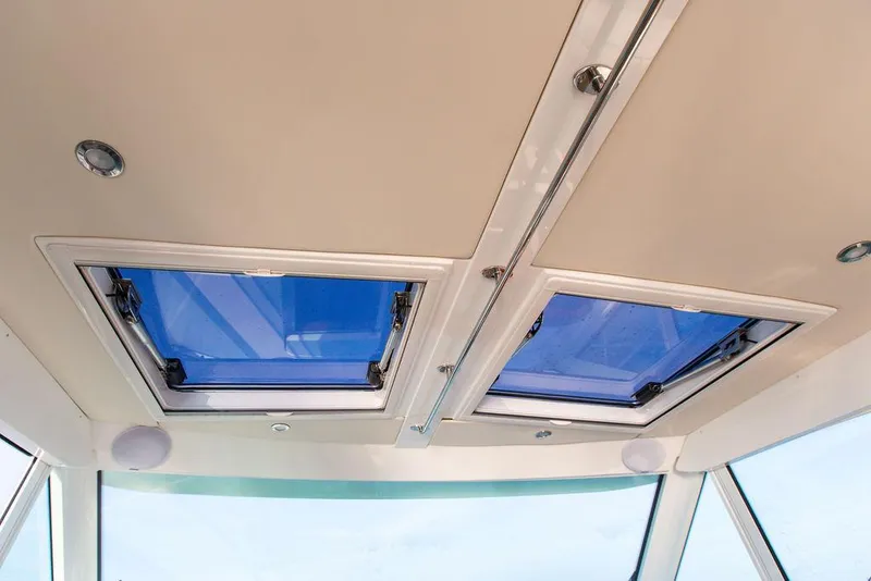 Slide: The Image of 2022 Hinckley Sport Boat 40 X cockpit with modern controls and seating. - 20