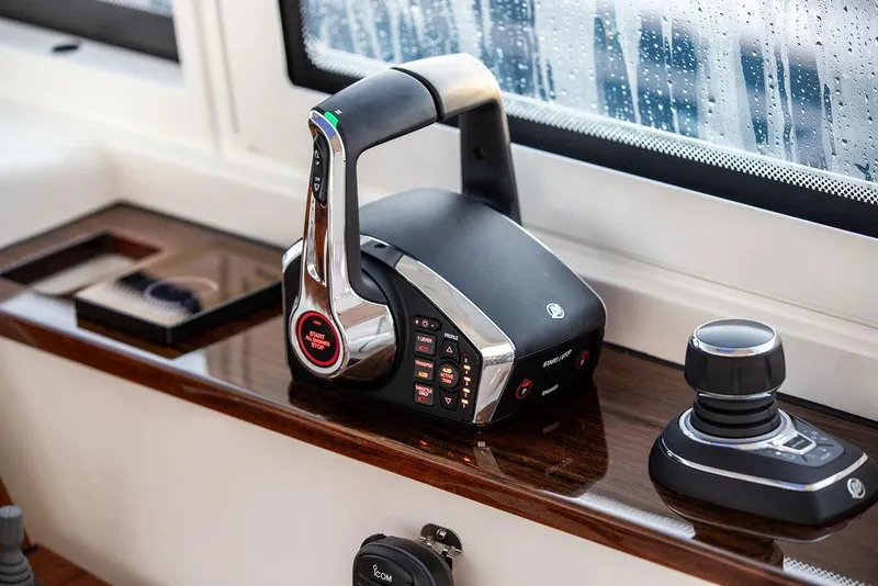 Slide: The Image of Striped seating on 2022 Hinckley Sport Boat 40 X, featuring teak deck and ocean view. - 31