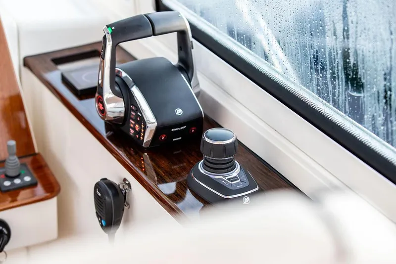 Slide: The Image of Hinckley Sport Boat 40 X 2022 cruising on water, showcasing deck and wake. - 32