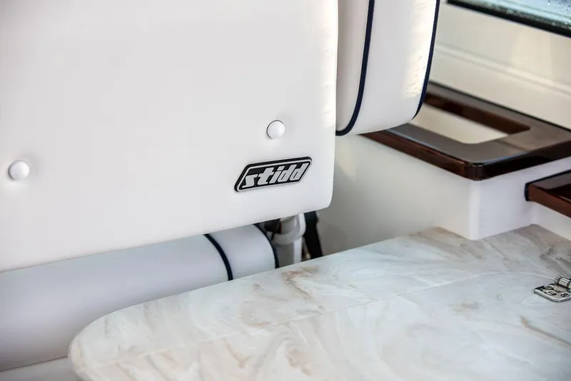 Slide: The Image of Control panel and striped seat on 2022 Hinckley Sport Boat 40 X. - 33