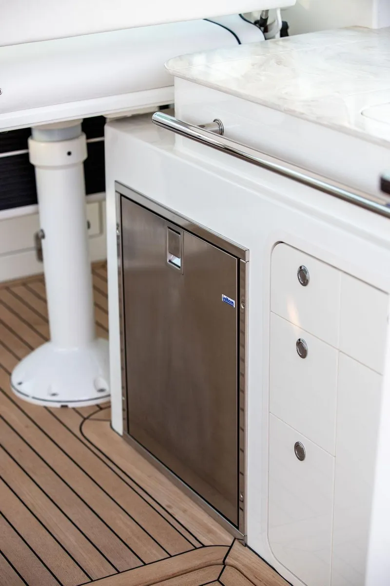 Slide: The Image of Hinckley Sport Boat 40 X 2022, teak deck detail with white fixture. - 35