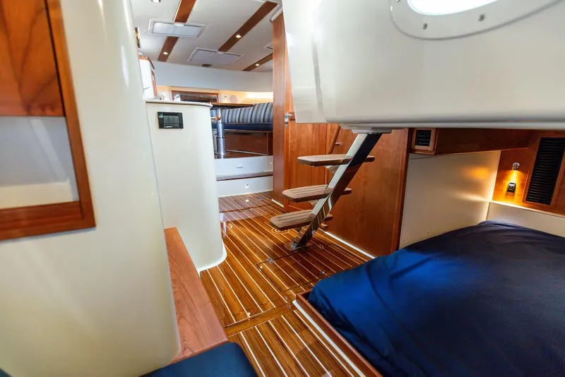 Slide: The Image of Interior of 2022 Hinckley Sport Boat 40 X with wooden finishes and modern design. - 44