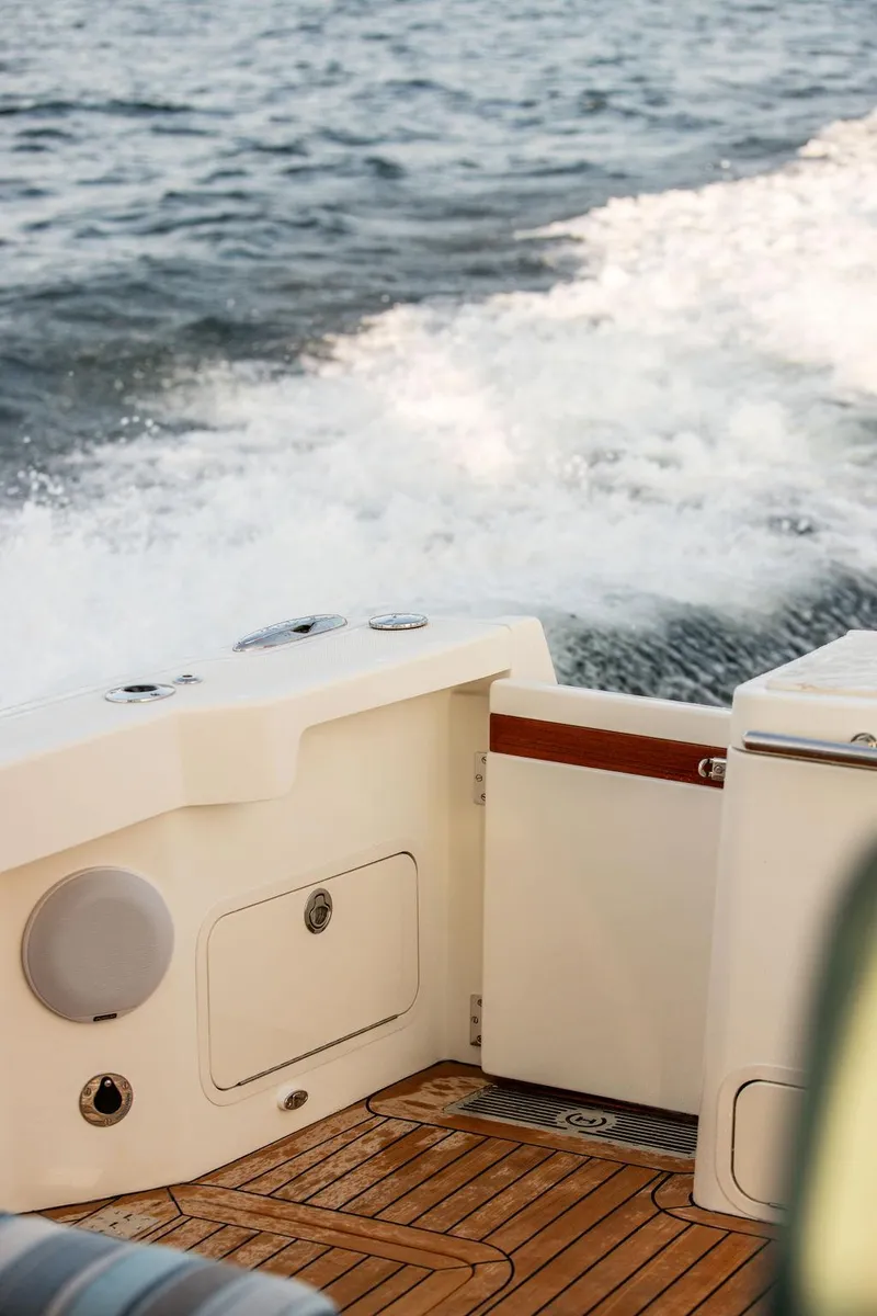 Slide: The Image of Helm of 2022 Hinckley Sport Boat 40 X with navigation screens and steering wheel. - 8