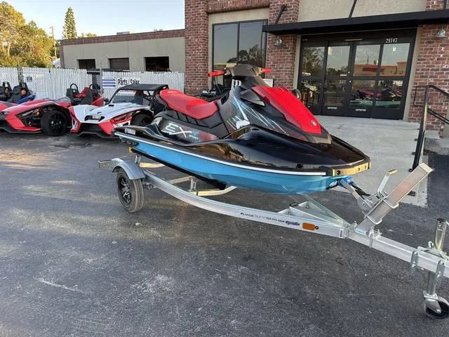 Slide: The Image of 2024 Yamaha Marine Waverunner EX SPORT in black and cyan, featuring red handlebars and sleek design. - 3